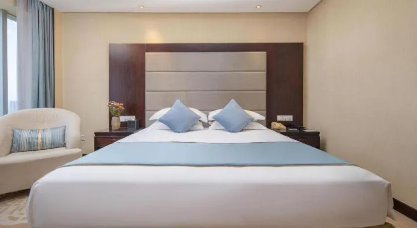Bed in Yiwu Yimei Plaza Hotel