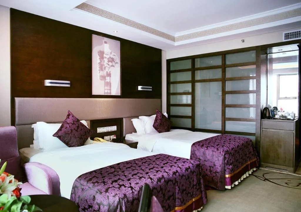 Bed in Yiwu Yimei Plaza Hotel