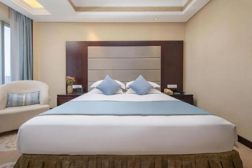 Bed in Yiwu Yimei Plaza Hotel