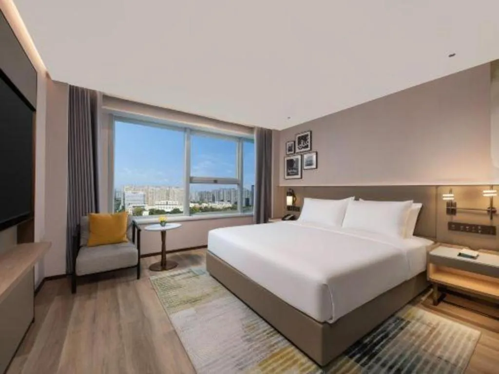 Bed in Yiwu Yimei Plaza Hotel