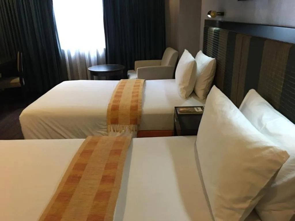 Bed in Baguio Burnham Suites Hotel