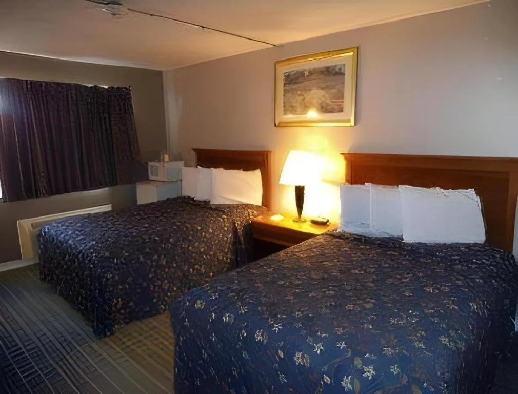 Bed in Days Inn by Wyndham West Branch Iowa City Area