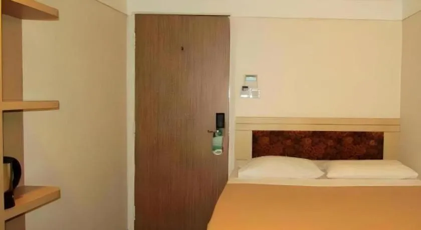 Bed in Arianna Hotel