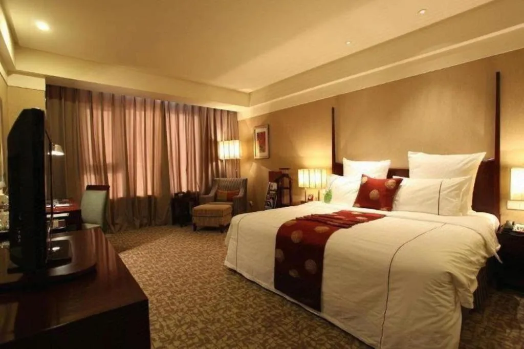 Bed in Grand New Century Hotel Binhai Tianjin