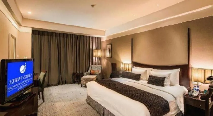 Bed in Grand New Century Hotel Binhai Tianjin