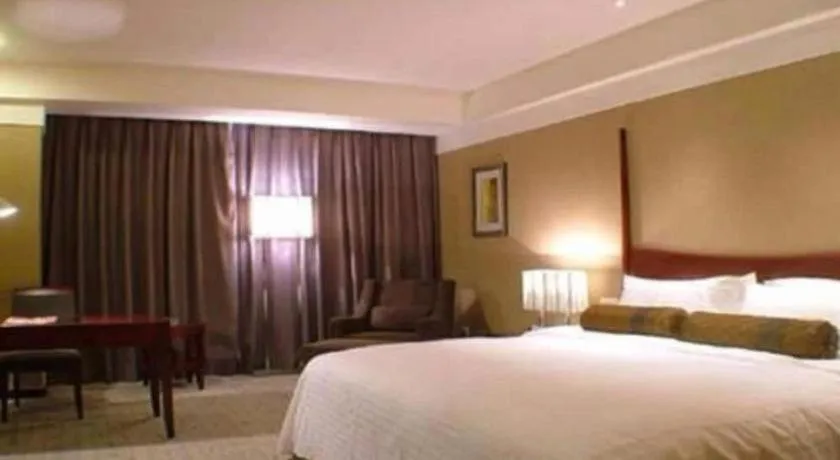 Bed in Grand New Century Hotel Binhai Tianjin