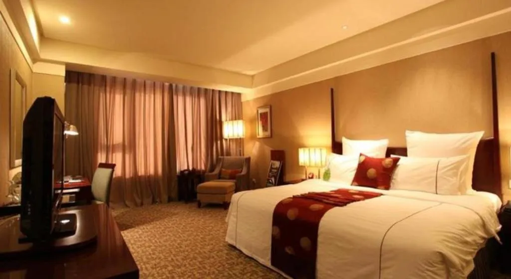 Bed in Grand New Century Hotel Binhai Tianjin