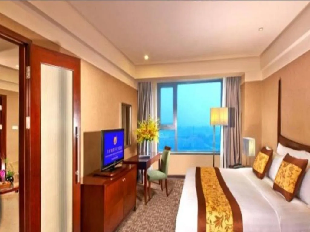 Bed in Grand New Century Hotel Binhai Tianjin