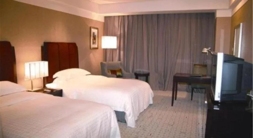 Bed in Grand New Century Hotel Binhai Tianjin