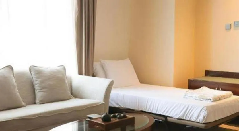 Bed in Grand New Century Hotel Binhai Tianjin