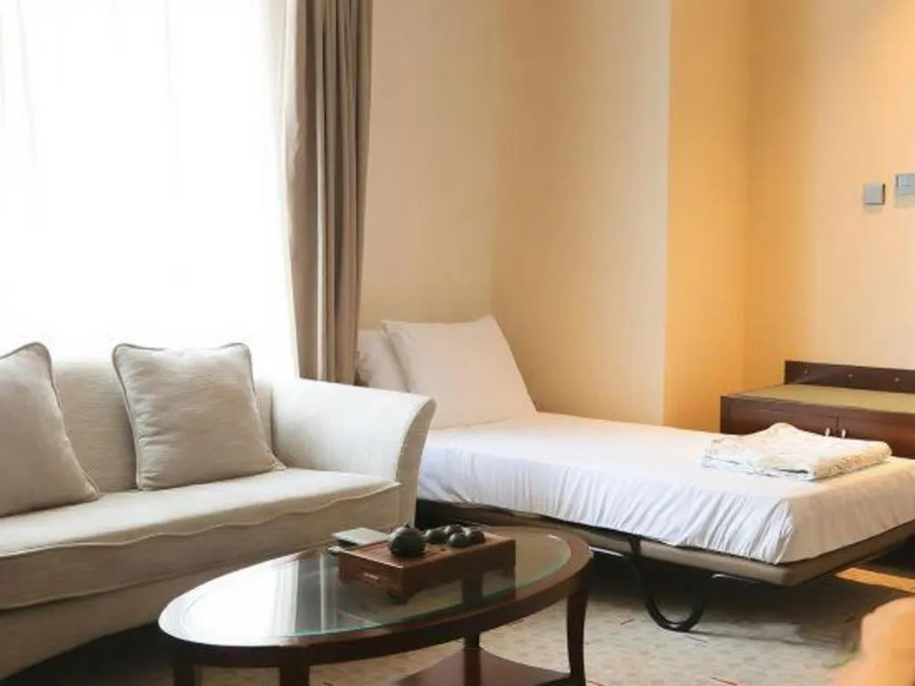 Bed in Grand New Century Hotel Binhai Tianjin