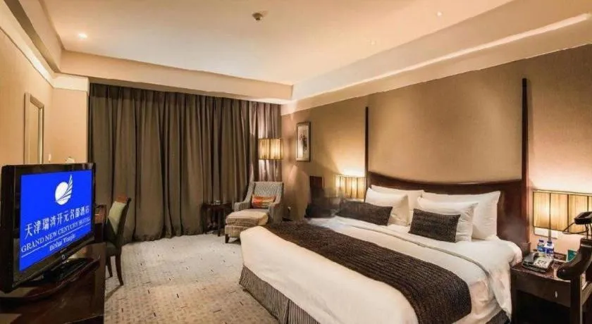 Bed in Grand New Century Hotel Binhai Tianjin