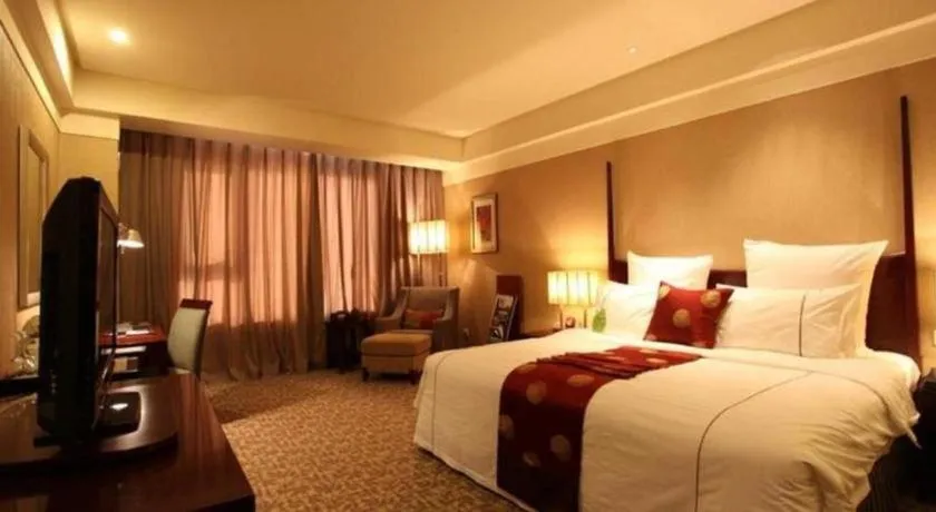 Bed in Grand New Century Hotel Binhai Tianjin