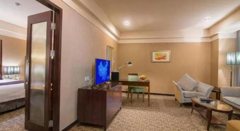 Bed in Grand New Century Hotel Binhai Tianjin