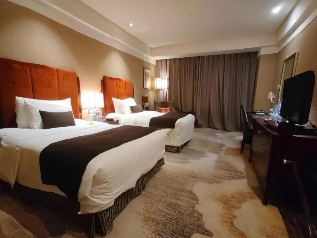 Bed in Grand New Century Hotel Binhai Tianjin