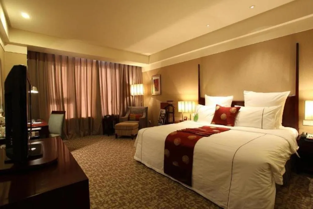 Bed in Grand New Century Hotel Binhai Tianjin