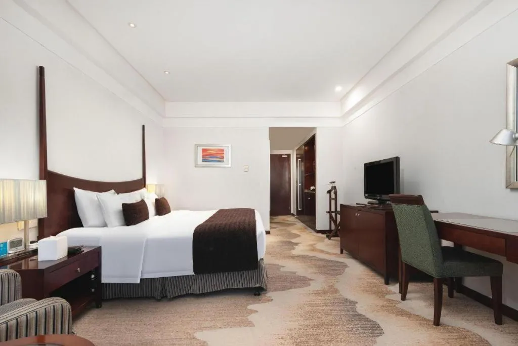 Bed in Grand New Century Hotel Binhai Tianjin