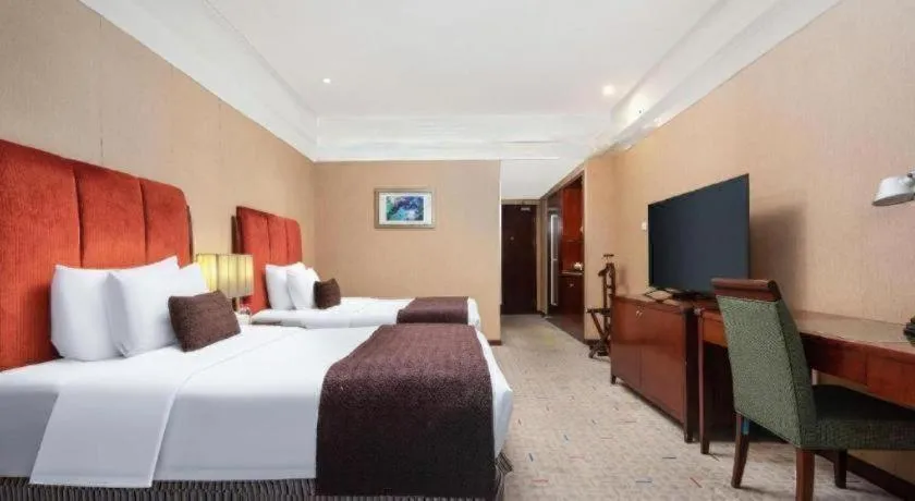 Bed in Grand New Century Hotel Binhai Tianjin