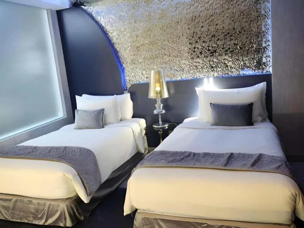 Bed in Glacier Hotel Khon Kaen