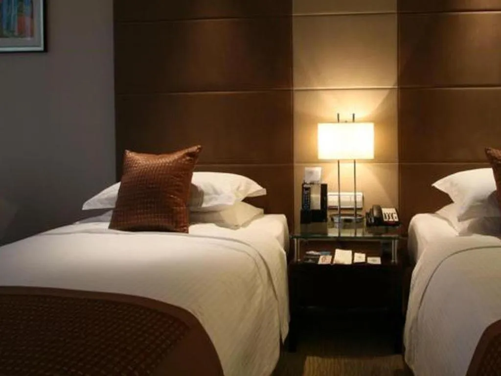 Bed in Beijing Liaoning Hotel