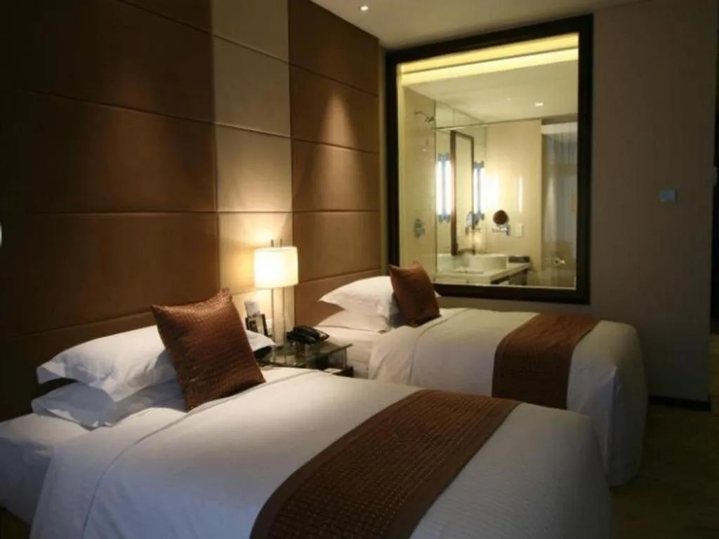 Bed in Beijing Liaoning Hotel