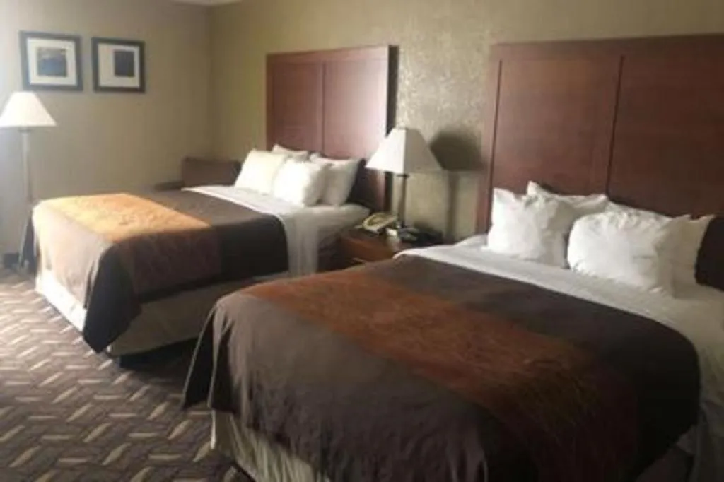 Bed in AmericInn by Wyndham Memphis East