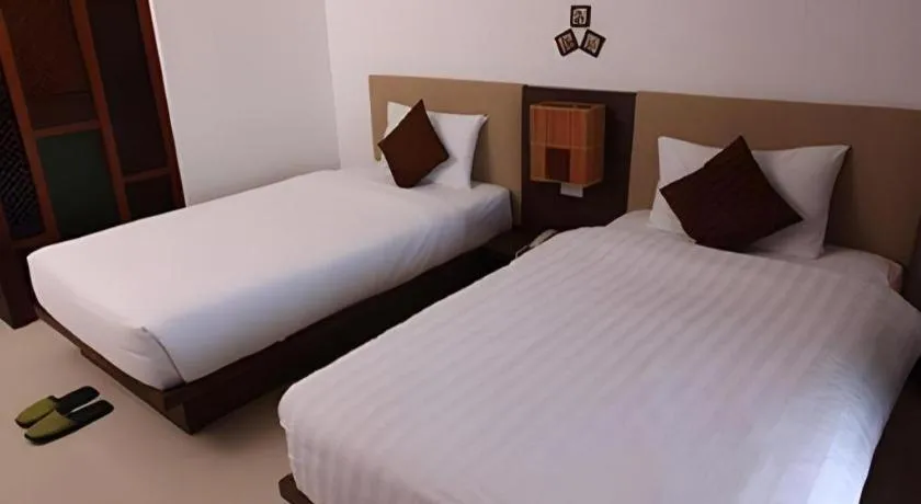 Bed in PhoomThai Garden Hotel