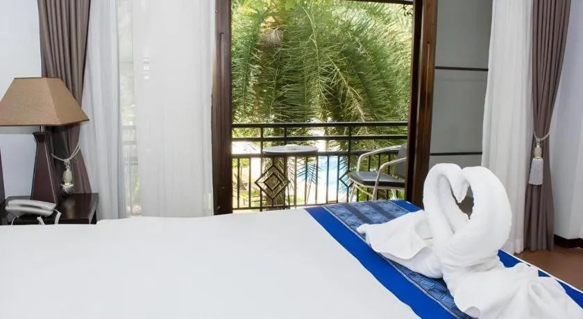 Bed in PhoomThai Garden Hotel