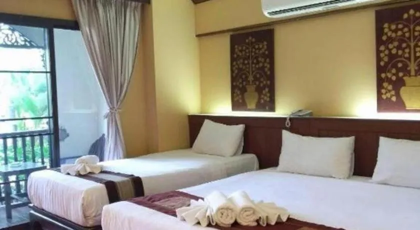 Bed in PhoomThai Garden Hotel