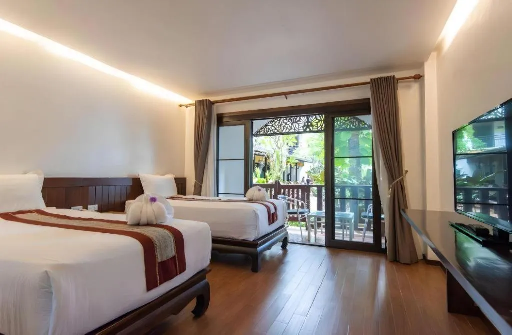 Bed in PhoomThai Garden Hotel