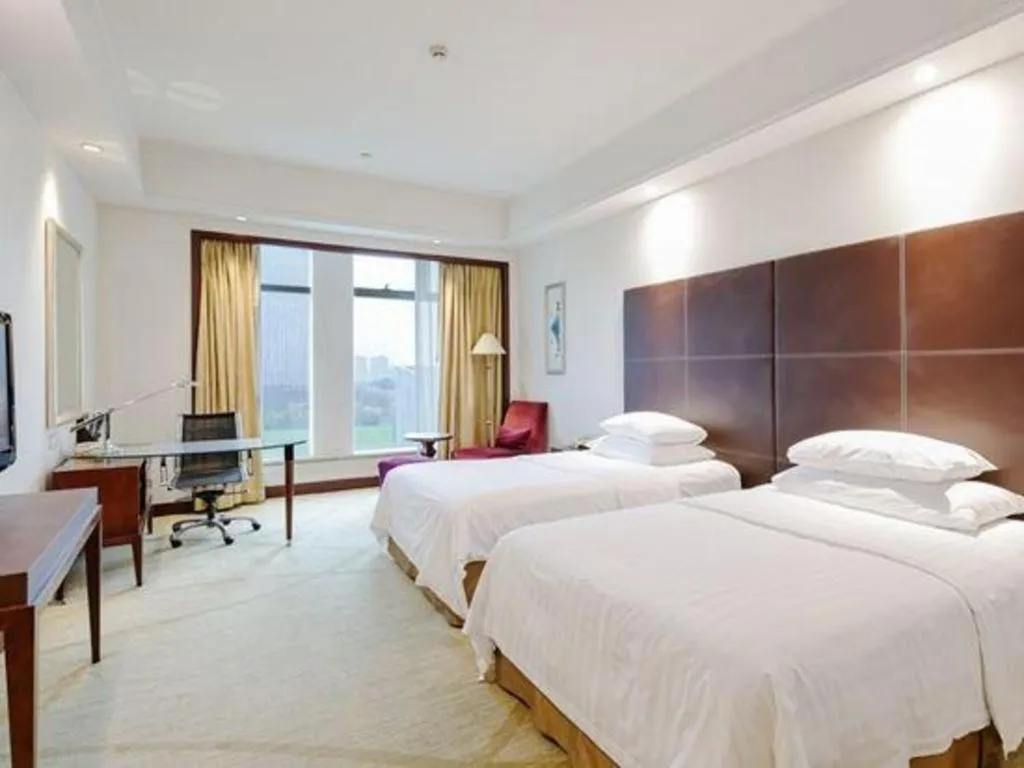 Bed in New Century Grand Hotel Zhuji Yaojiang