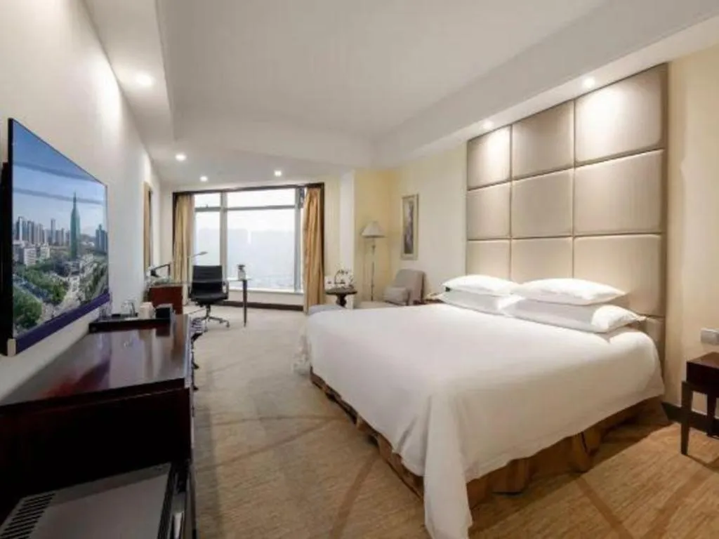 Bed in New Century Grand Hotel Zhuji Yaojiang