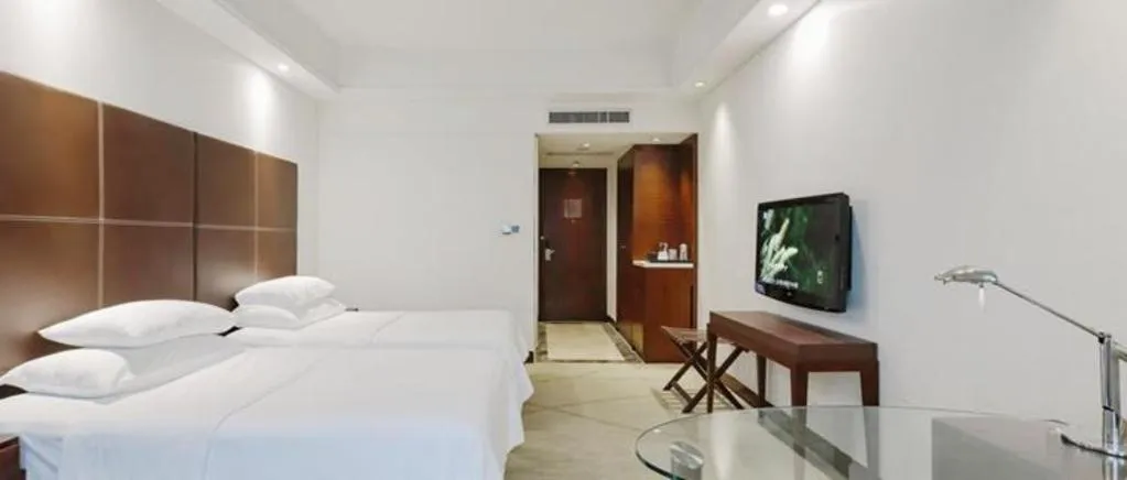 Bed in New Century Grand Hotel Zhuji Yaojiang