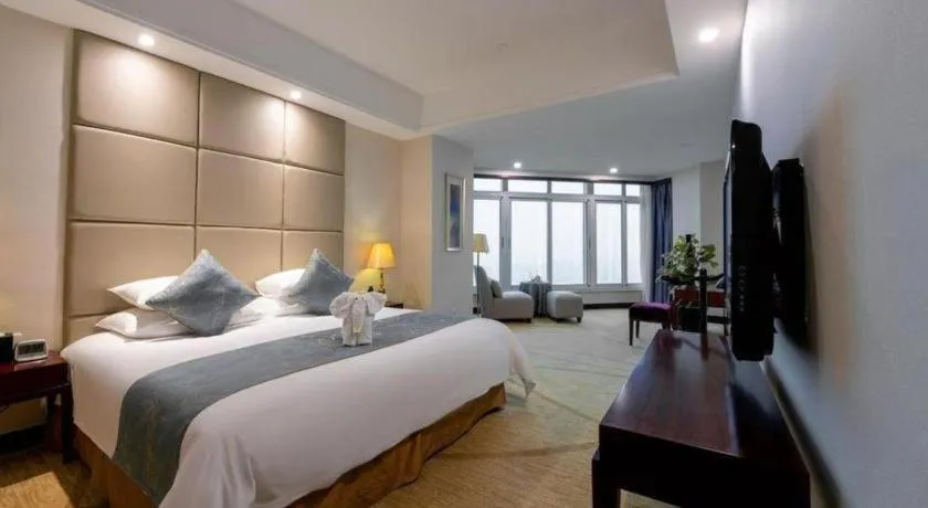 Bed in New Century Grand Hotel Zhuji Yaojiang
