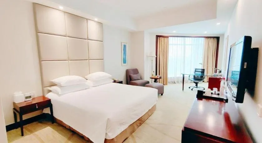 Bed in New Century Grand Hotel Zhuji Yaojiang