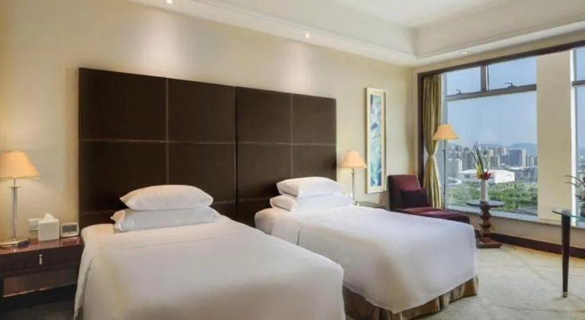 Bed in New Century Grand Hotel Zhuji Yaojiang