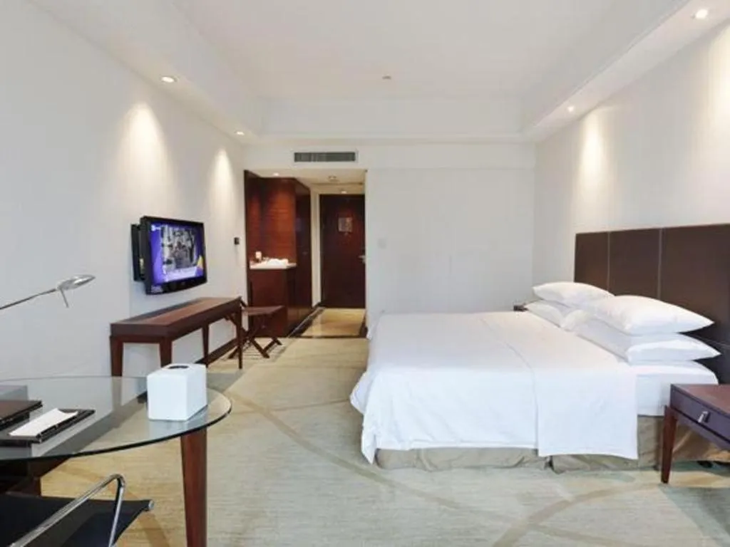 Bed in New Century Grand Hotel Zhuji Yaojiang
