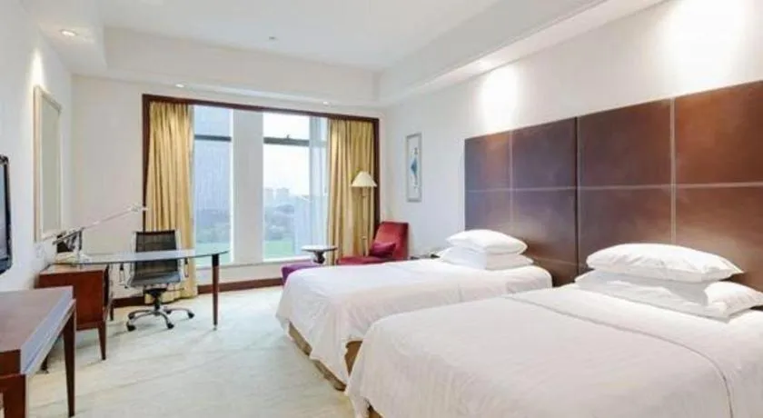 Bed in New Century Grand Hotel Zhuji Yaojiang