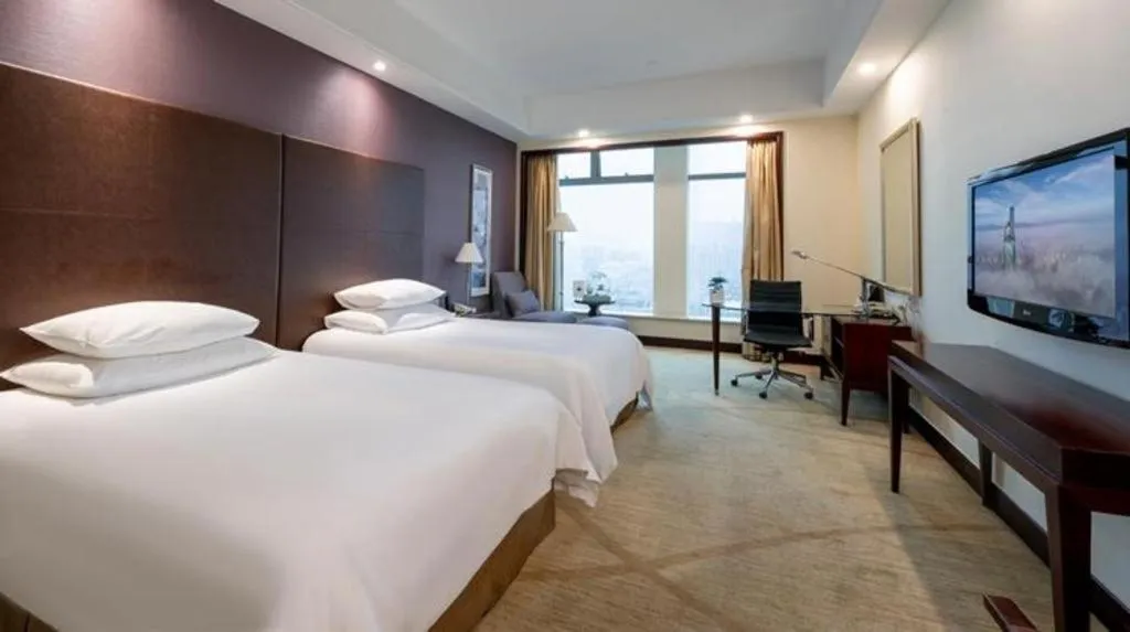 Bed in New Century Grand Hotel Zhuji Yaojiang