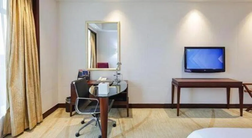 Bed in New Century Grand Hotel Zhuji Yaojiang