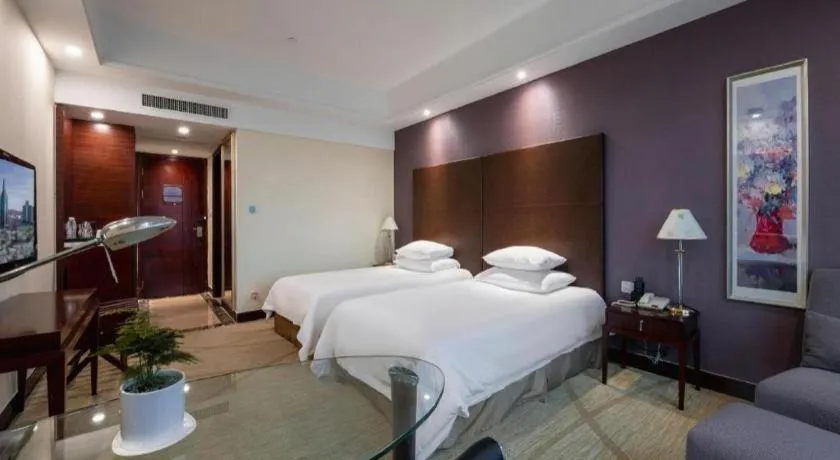 Bed in New Century Grand Hotel Zhuji Yaojiang