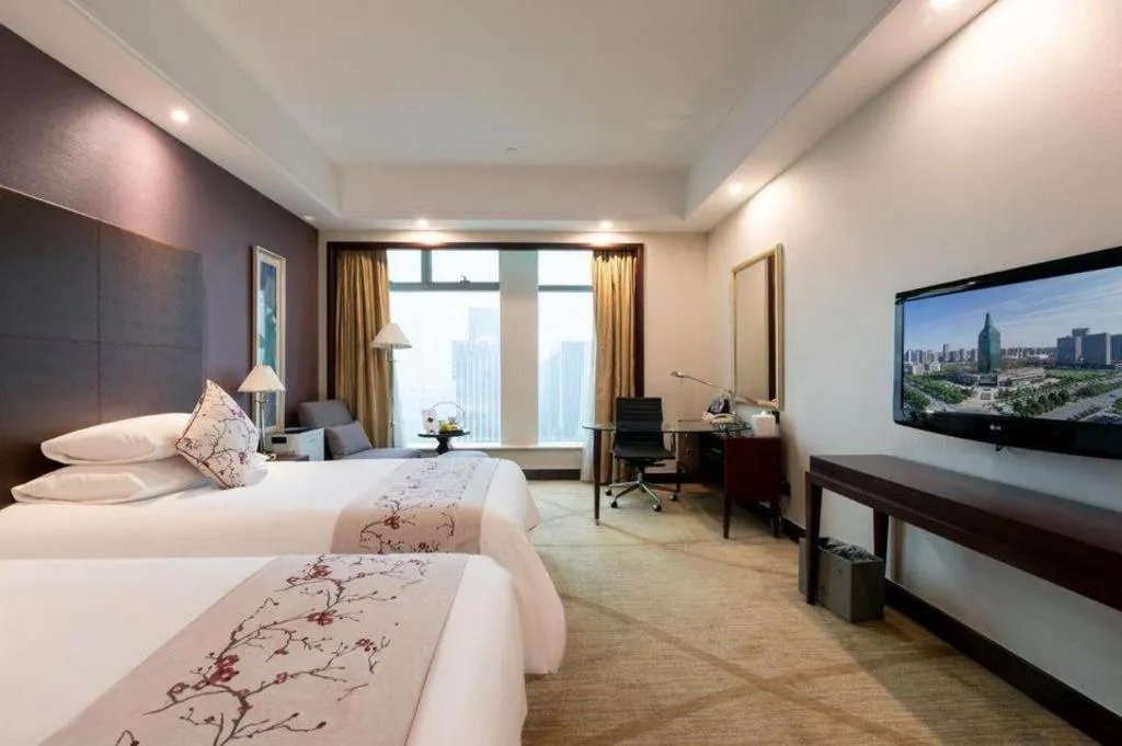 Bed in New Century Grand Hotel Zhuji Yaojiang