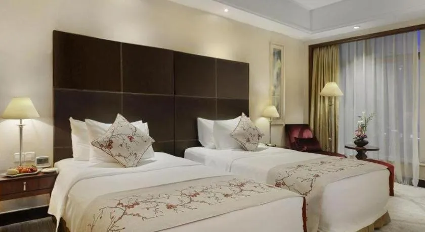 Bed in New Century Grand Hotel Zhuji Yaojiang