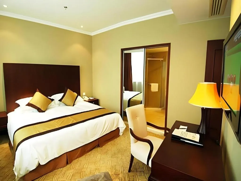 Bed in New Century Grand Hotel Zhuji Yaojiang
