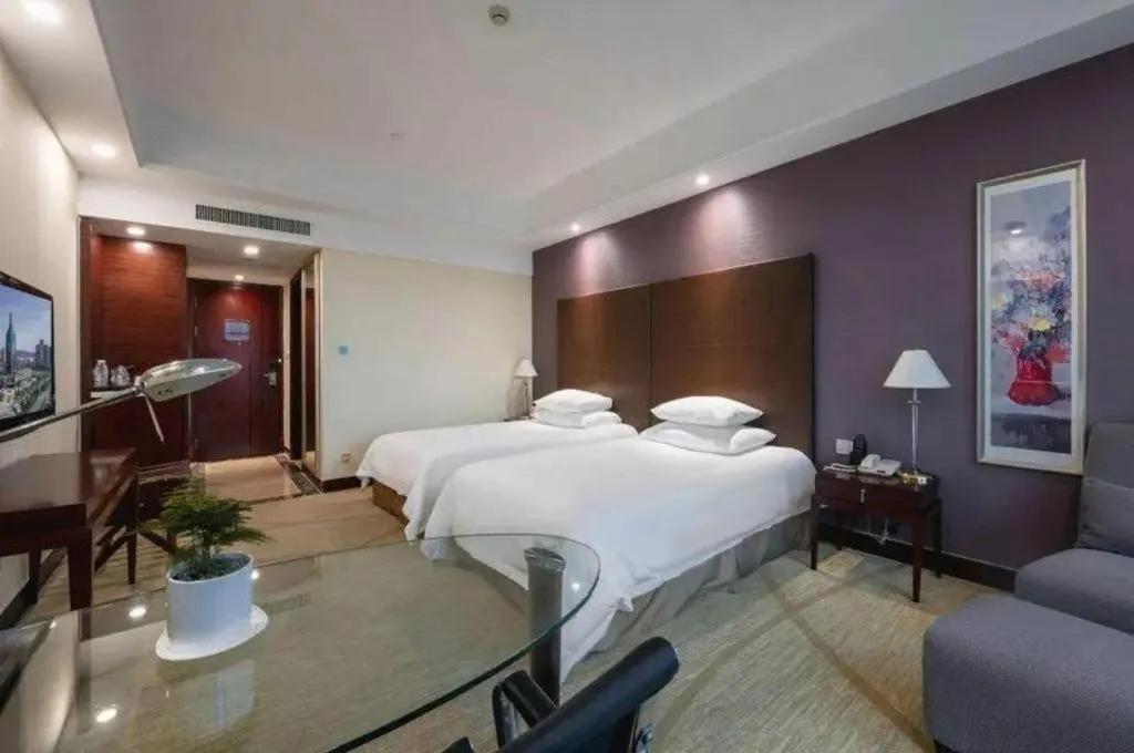 Bed in New Century Grand Hotel Zhuji Yaojiang