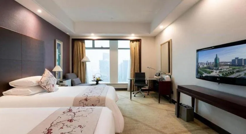 Bed in New Century Grand Hotel Zhuji Yaojiang