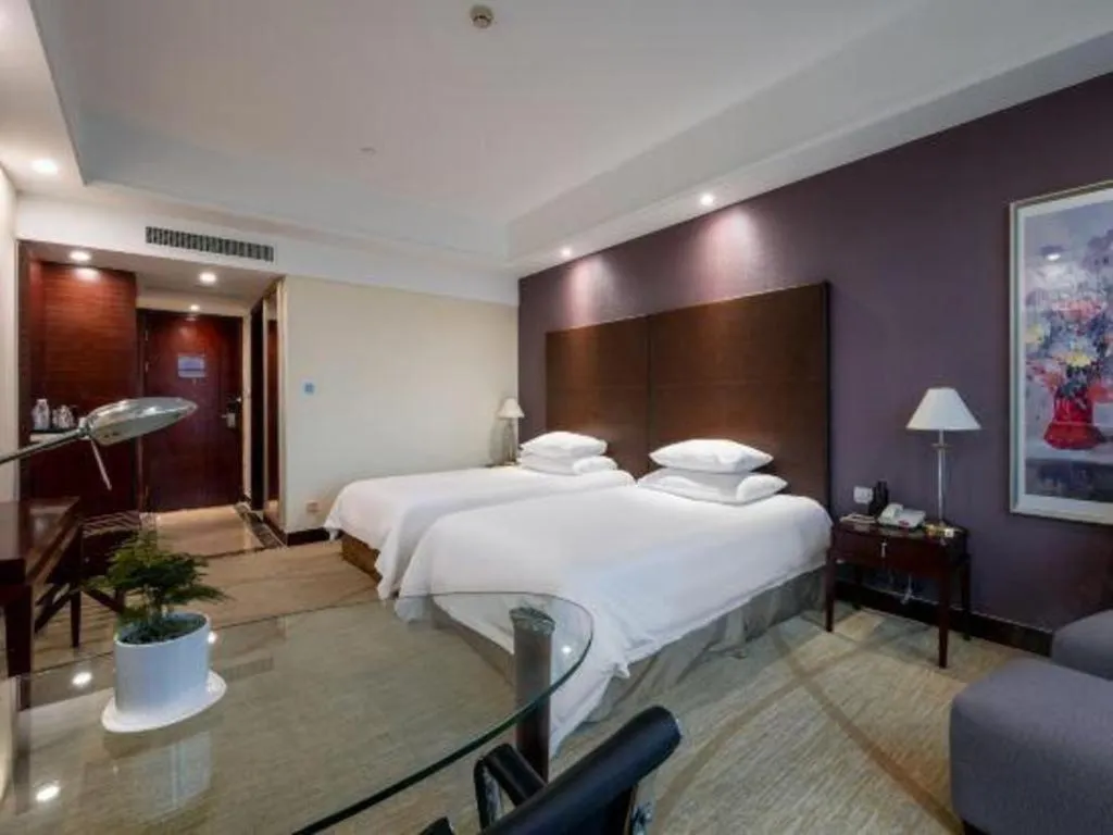 Bed in New Century Grand Hotel Zhuji Yaojiang