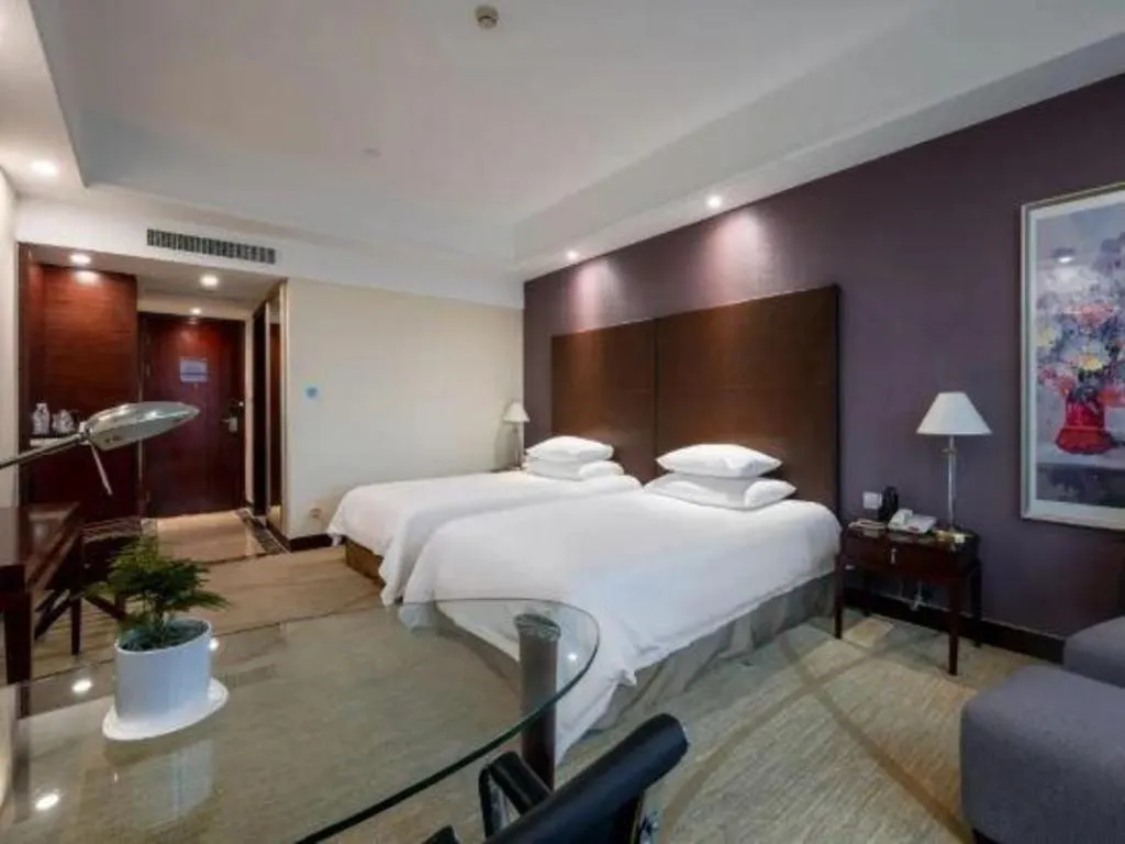 Bed in New Century Grand Hotel Zhuji Yaojiang