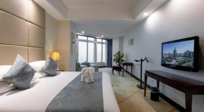 Bed in New Century Grand Hotel Zhuji Yaojiang