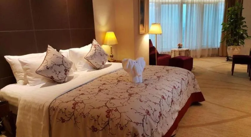 Bed in New Century Grand Hotel Zhuji Yaojiang